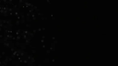 Slow motion air particle practical effect on black Stock Footage 107995144