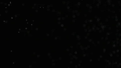 Slow motion air particle practical effect on black Stock Footage 107995349