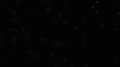 Slow motion air particle practical effect on black Stock Footage 107997491