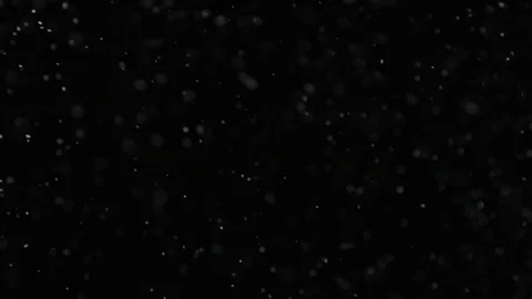 Slow motion air particle practical effect on black Stock Footage 107998528