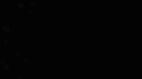 Slow motion air particle practical effect on black Stock Footage 107998764