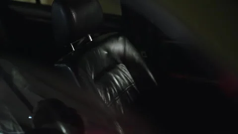 Slow motion airbag inflating inside a dark car Stock Footage 329283232