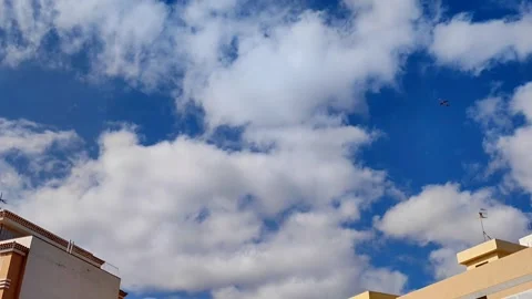 Slow Motion Airplane Flying Over Residential Buildings - 1080p Video stock 334628884
