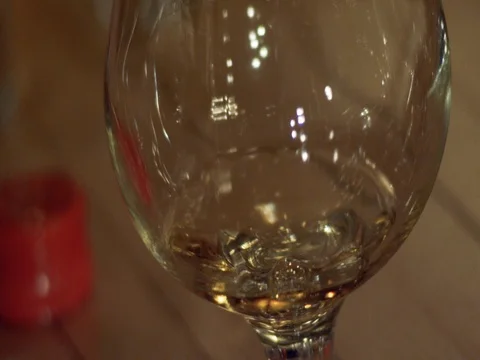 Slow Motion Alcohol in Brandy in Snifter Stock Footage 71507359