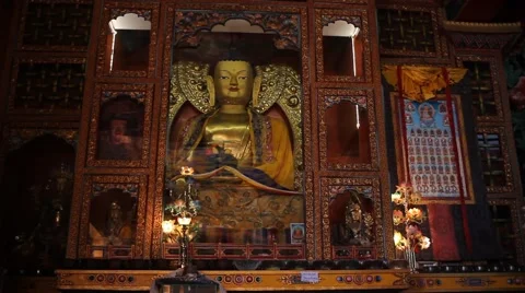 Slow motion along the Buddha statue behind glass Video stock 58937924