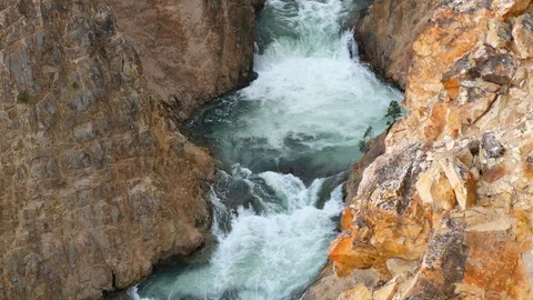 Slow motion of amazing rapids and waterfalls in yellowstone canyon Stock Footage 97535899