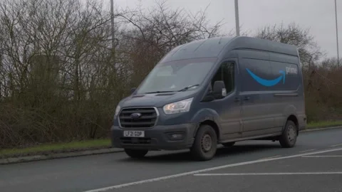 Slow motion. Amazon prime delivery van in urban setting. Hull.UK 4.2.2026 Stock Footage 329418439