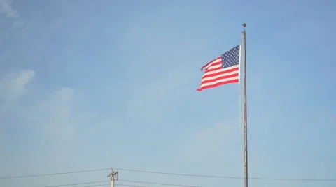 Slow Motion American Flag Blowing in Wind Vídeo Stock 55225580