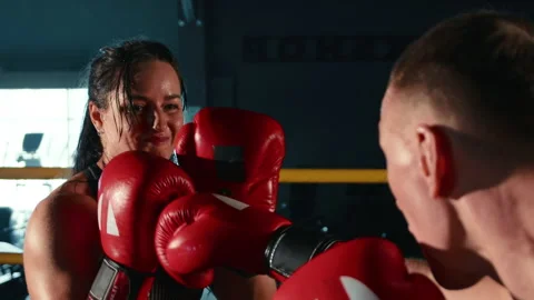Slow-Motion Analysis of Female Boxer Perfecting Technique with Coach's Help Stock Footage 270709970