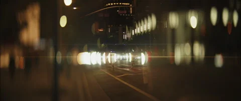 Slow Motion Anamorphic Blur with Dancing City Lights, traffic downtown LA Stock Footage 300303852