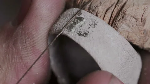 Slow motion and macro closeup. Professional jewelry craftsman use manual jigsaw Stock Footage 109102909