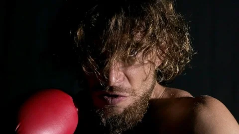 Slow motion of angry boxer in front of camera. Stock Footage 92163670