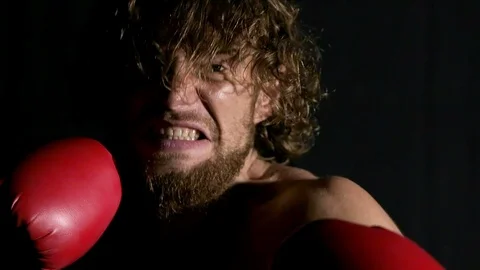 Slow motion of angry boxer screaming in front of camera. Stock Footage 92206119
