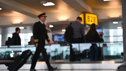 Slow motion of anonymous airplane pilot walking on airport Video stock 126007380