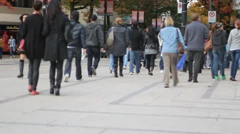 Slow motion anonymous crowd walking on street Stock Footage 10559418