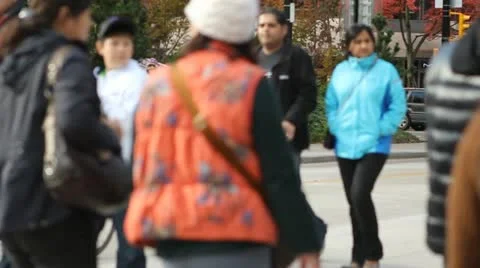 Slow motion anonymous crowd walking on street - panned Stock Footage 11489119