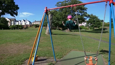 Slow motion anonymous female On Swing 스톡 동영상 77014357