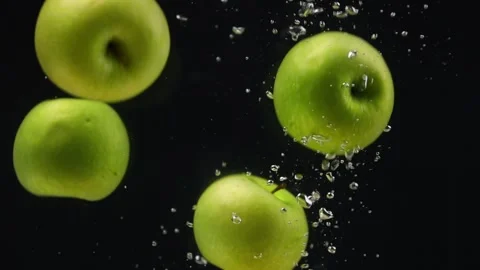 Slow motion of apple fruit in water Stock Footage 243714097