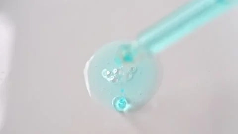 The slow-motion application of a red substance that resembles blood on whit.. Video stock 267991073