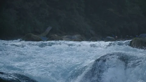 Slow Motion Of Aqua Marine River Water Flowing Over Boulders In Patagonia Stock Footage 70375342