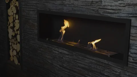 Slow motion artificial fireplace burns in house dim room Stock Footage 103924899