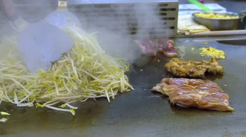 Slow motion Asia people cooking beansprouts and meat in Taiwan Night Market -Dan Stock Footage