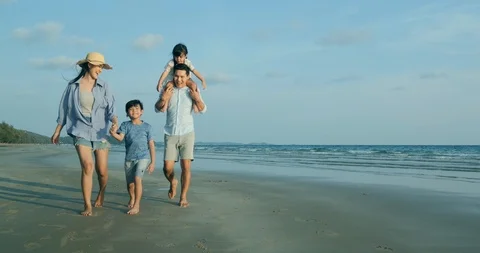 SLOW MOTION, Asian family walking with happy emotion at beach together. Stock Footage