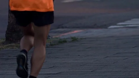 Slow Motion of asian man running on the street of Taipei city at nigth. Road-Dan Stock Footage 98779692