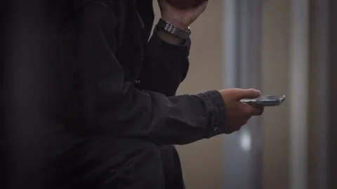 Slow motion of Asian man using smartphone inside Chengdu metro Stock Footage 314575657
