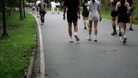 Slow motion of Asians jogging in city public park Stock-Footage 341887341