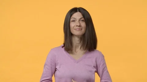 Slow-motion assertive cheeky middle-aged modern urban woman pointing finger Stock Footage 123010777