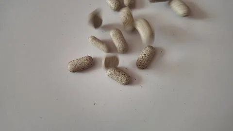 Slow Motion Assorted Pills Falling on White Background – Close-Up Healthcare Stock Footage 339131284