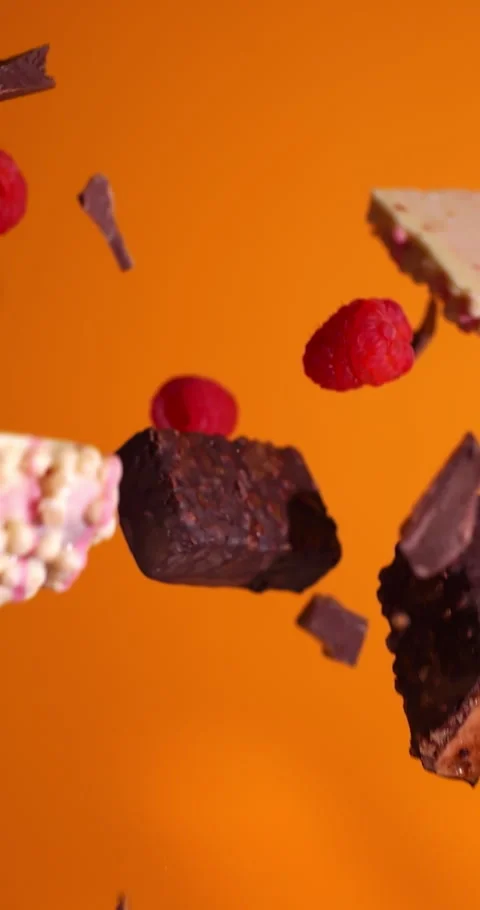Slow Motion Assorted Protein Bars and Raspberries Floating 動画素材 308608605