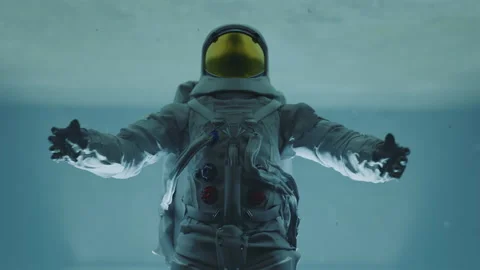 Slow motion astronaut spreading hands and falling into bright path or opened Stock Footage 219929086