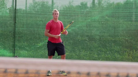 Slow Motion Of Athletic Tennis Player On Clay Court Stock Footage 34477672