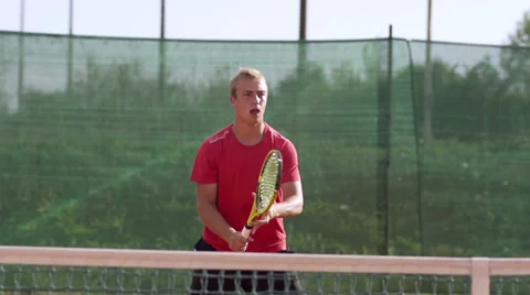 Slow Motion Of Athletic Tennis Player Training On Clay Court Stock Footage 34480097