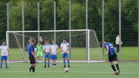 Slow Motion, Attacker shoots over the Defensive Wall from direct free-kick Vidéo 341107467