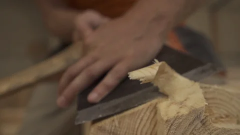 Slow motion as an ax to remove shavings from a wooden bar Stock Footage 98120936