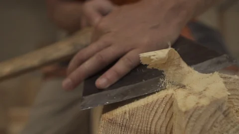 Slow motion as an ax to remove shavings from a wooden bar Stock Footage 98120939