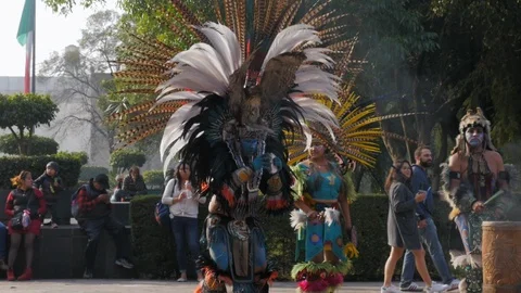 Slow Motion, Aztec Dancer Playing Conch Shell in Full Regalia During Stock Footage 104797987