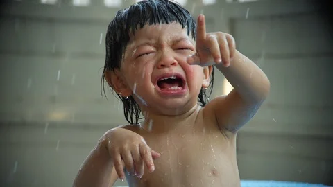 Slow motion, baby crying while play the water splashing Stock Footage 89780617