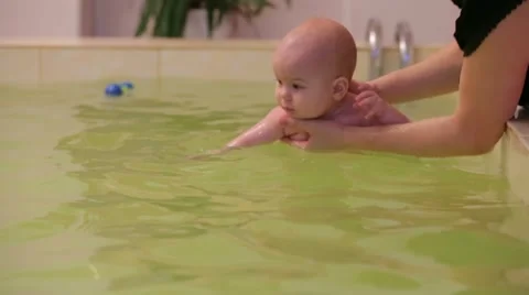 SLOW MOTION. Baby Diving Stock-Footage 63348837