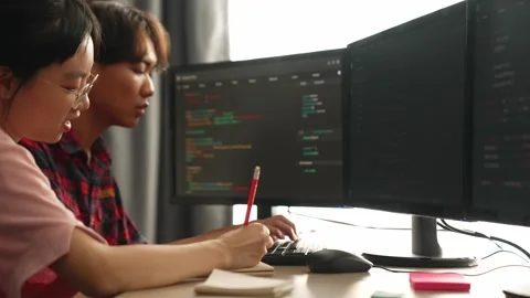 Slow motion back end software developer engineer writing code. Burgeoning Stock Footage 263270423