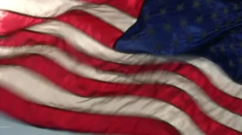 Slow motion Back-lit American flag flying strong Video stock 10687315