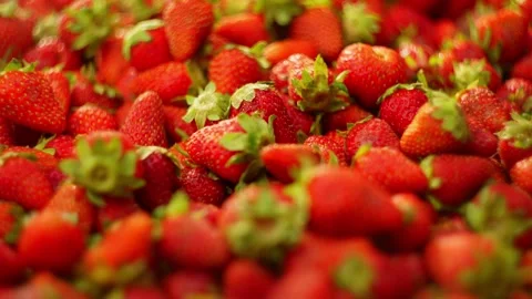 Slow motion background video of strawberry falling on berries. . Video stock 278830511