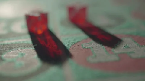 Slow motion backward tracking red dice with rack focus Stockbeeldmateriaal 335699899