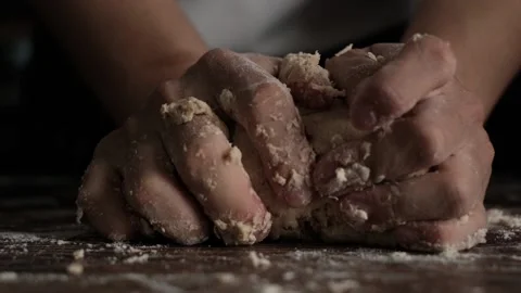 Slow Motion bakery chef kneeding dough on wooden table. Stock Footage 142703657