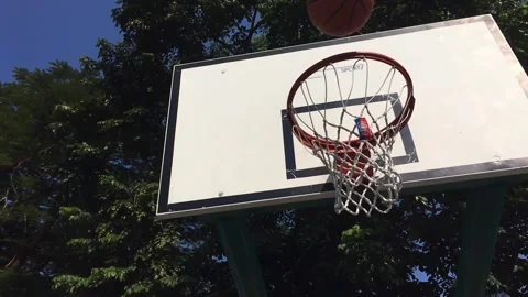 Slow motion of a ball successfully shot a basketball hoop Stock Footage 144857262