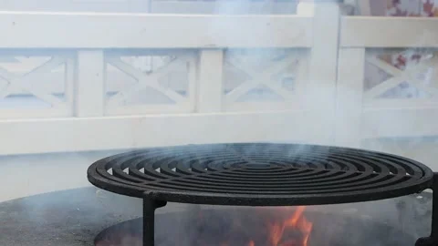 Slow motion of barbecue grill with fire flames. Empty fire grid. Soft focus. Stock Footage 235378780