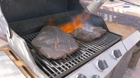 Slow Motion of Barbecue Meat Being Flame Grilled Stock Footage 104161716